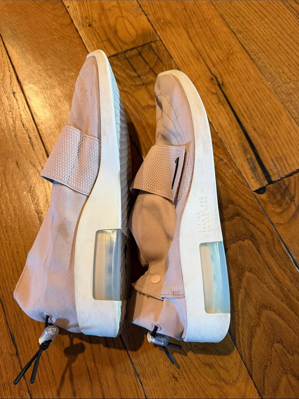 Nike Men’s Slip-On Training Shoes in Pale Pink with Black Swoosh